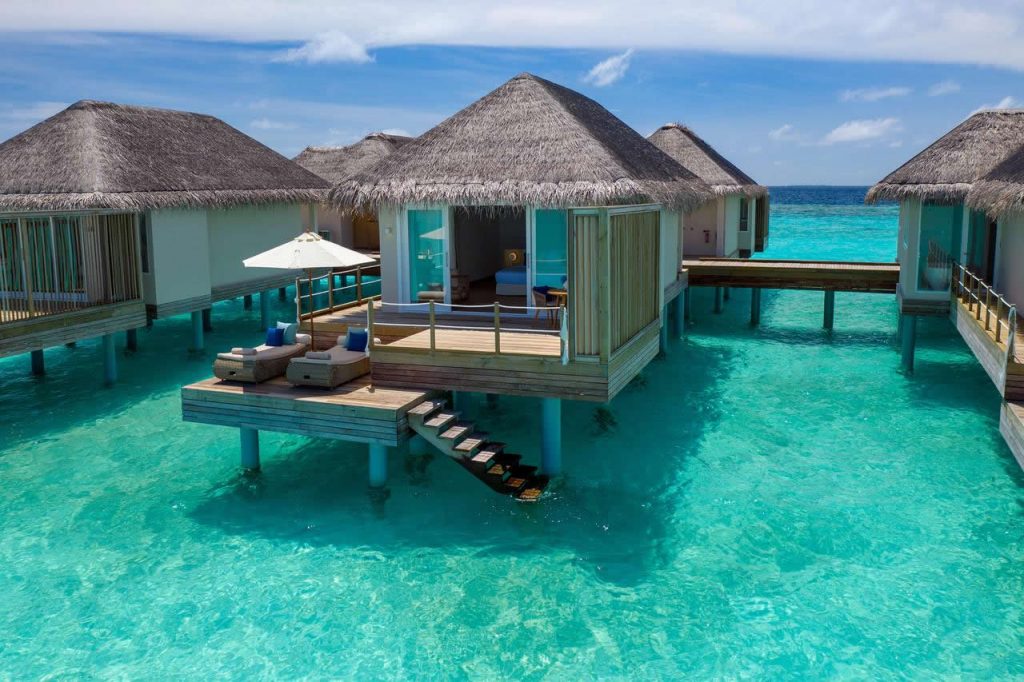 over water villa bungalow at baglioni resort maldives with stairs into the lagoon sea