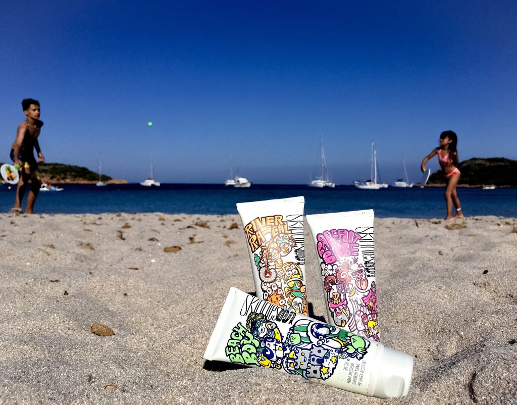 sunscreen for babies and kids - skinnies kids -children playing paddle on beach