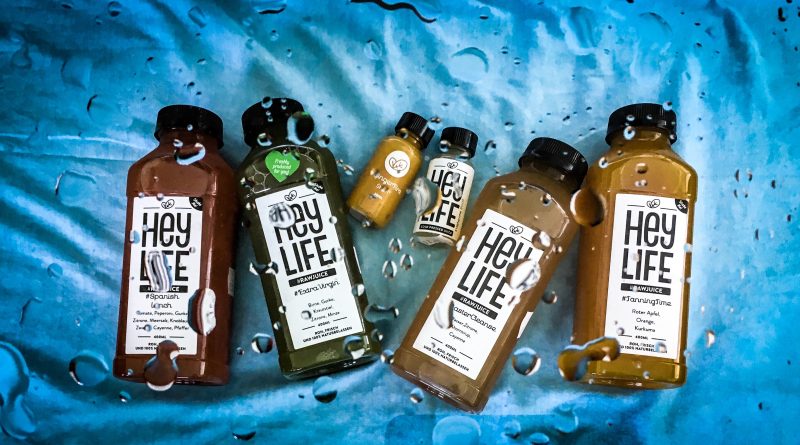 how to do a juice cleanse in summer - selection of heylife raw juice bottles