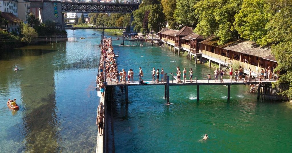 overview of Unterer Letten RIver Swimming Area with people swimming and kayaking