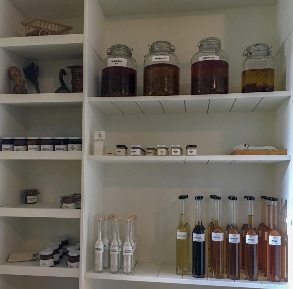 selection of bottles and jars of homemade condiments and mixers for sale at Krauter Hotel Edelweiss shop