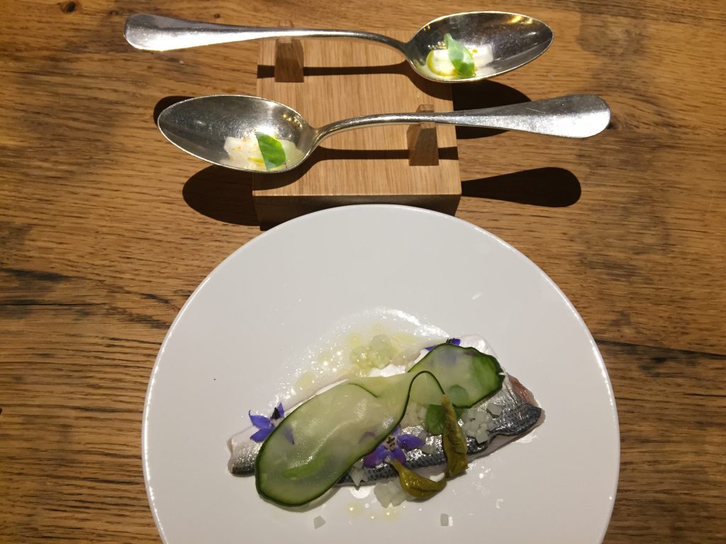 Spoonfuls of Oyster Leaf accompanied by freshly caught fish from Lake Lucerne