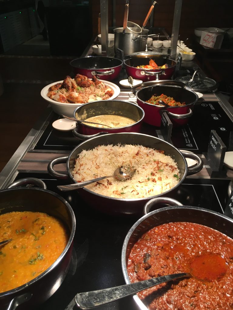 selecion of north indian curries on the stove