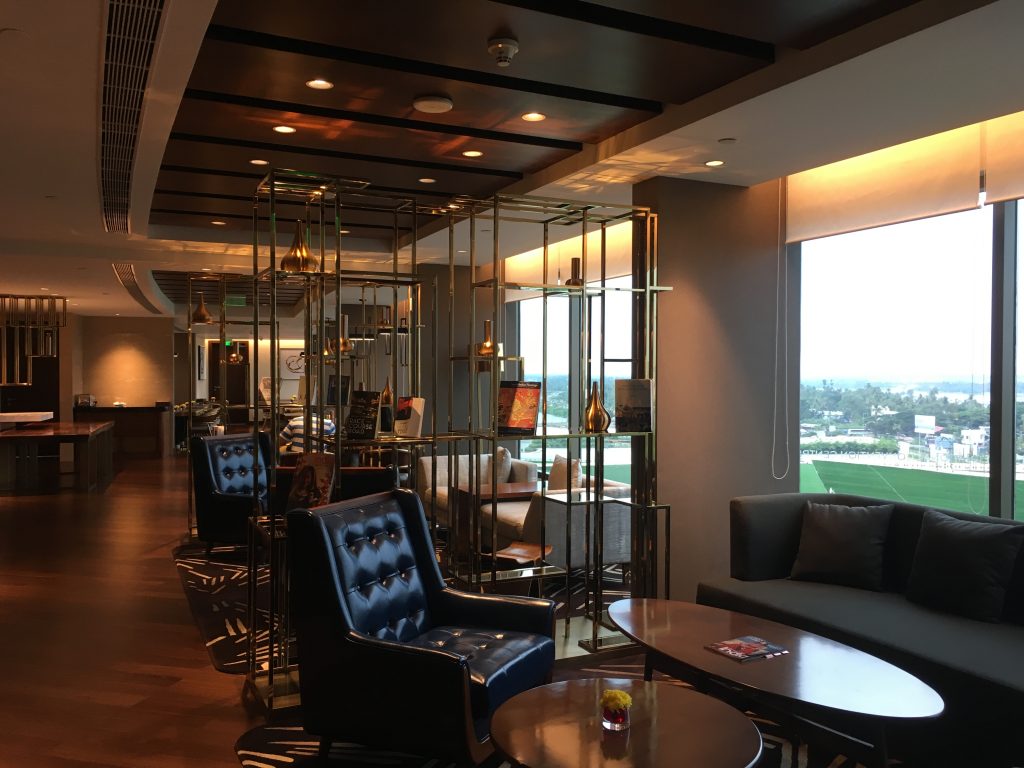 elegant seating areas of the grand club lounge with views of kochi