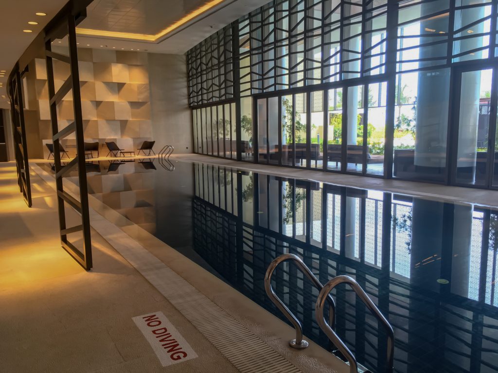 comtemporary interior with a feature wall inside the indoor swimming pool