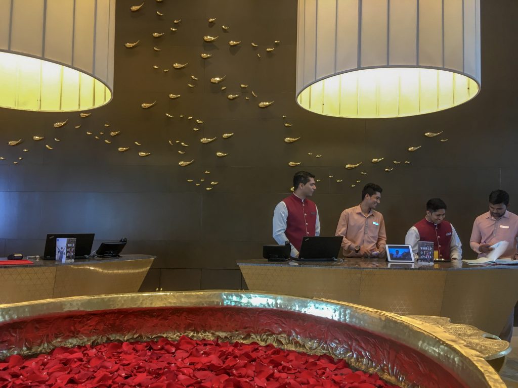 group of receptionist at the hotel lobby smiling 