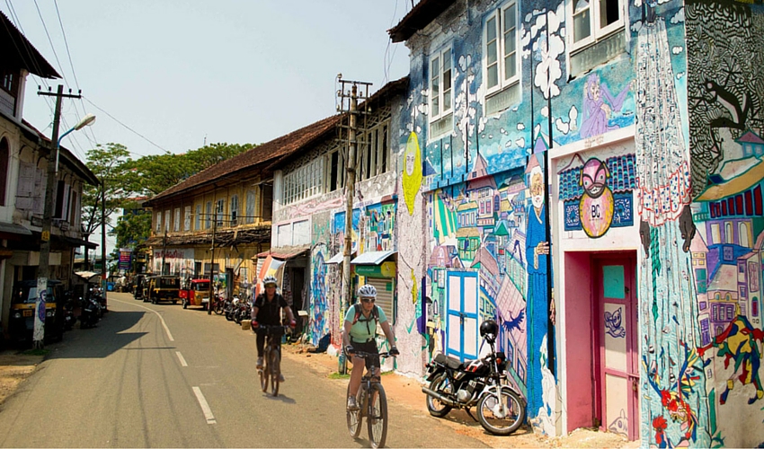 street art around fort kochi with cyclist 