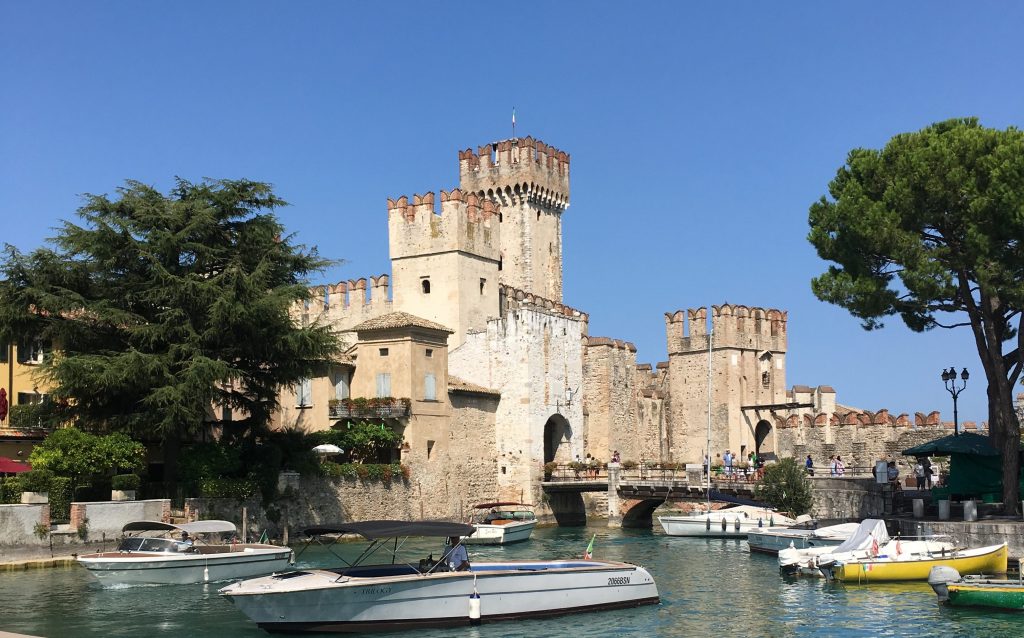 scaliger castle and port of sirmione with boats