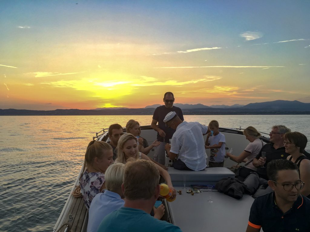 sunset cruise around lake garda with drinks on Bertoldi Boat