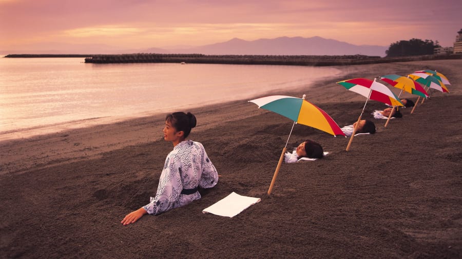 ladies in yukata by the black sand beach sand bathing