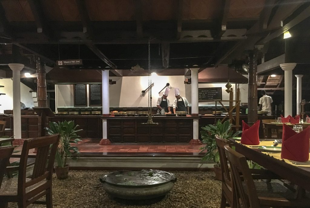 two chefs behind their cooking station in Ettukettu restaurant