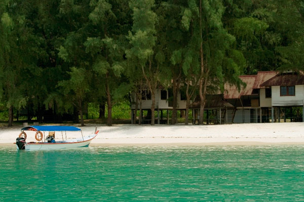 Island Hopping in Langkawi, Malaysia, Pulau Beras Basah beach with boat and trees
