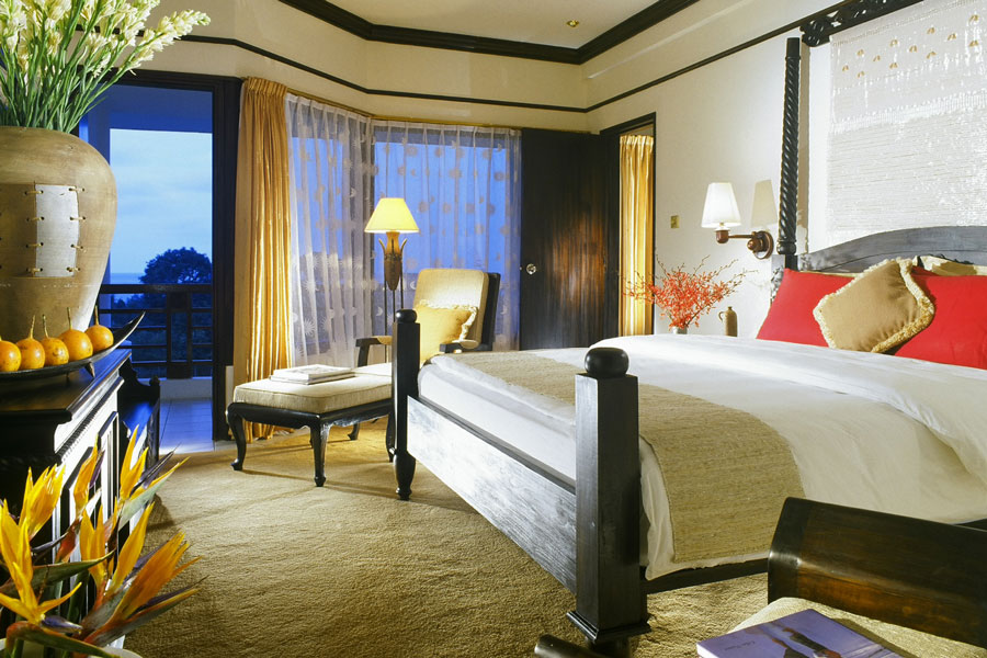 Forest Suite bedroom interior at Bintan Lagoon Resort with King size bed and balcony