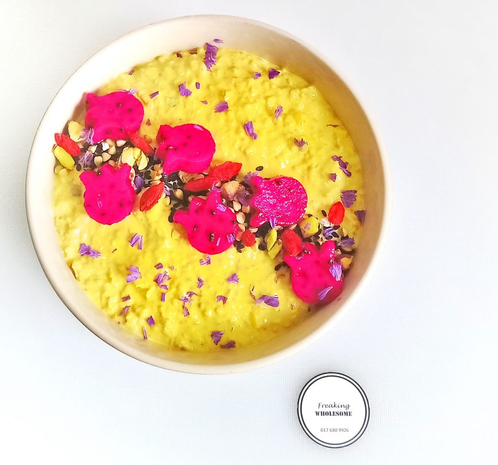 bowl of golden kombucha bircher muesli with ginger and spices