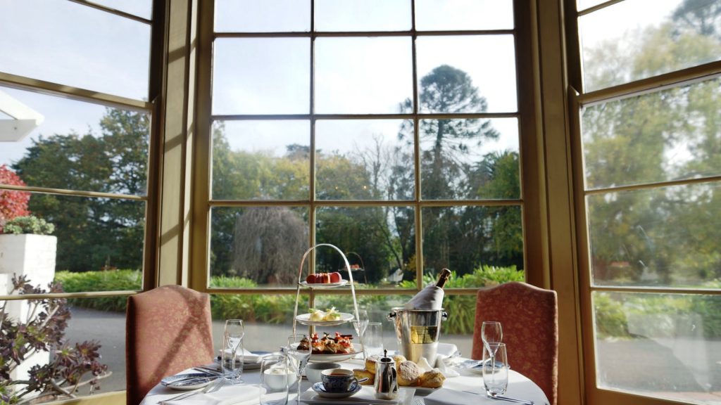 high tea set with champagne at Chateau Yering overlooking garden