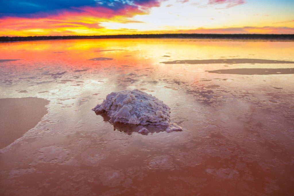 pink lake at Murray-sunset national park with salt formation piled up during sunset