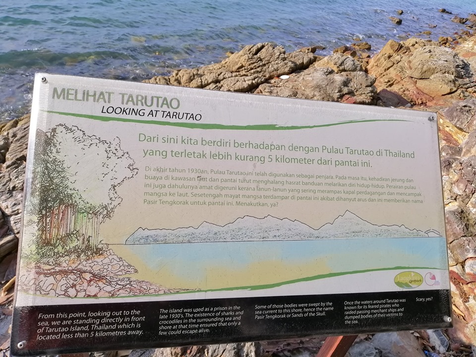 pasir tengkorak best beach in langkawi overlooking ko tarutao signboard with history of the sandy skulls beach