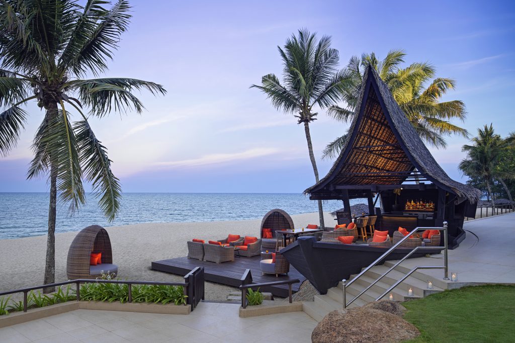 sampan malay wooden boat shape beach bar sunset 