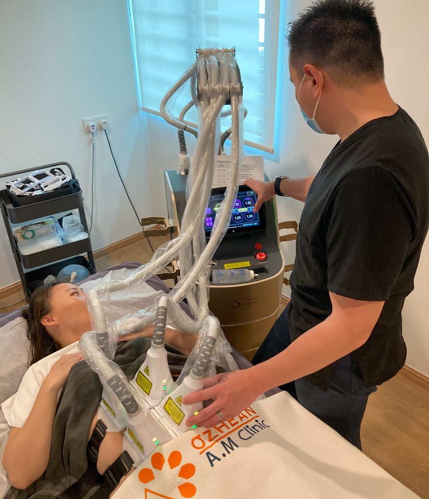 Doctor explaining to patient on bed with le shape laser lipolysis machine hooked on - body shaping slimming treatment with le shape