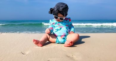 best baby sunscreen sun cream baby on beach with hat