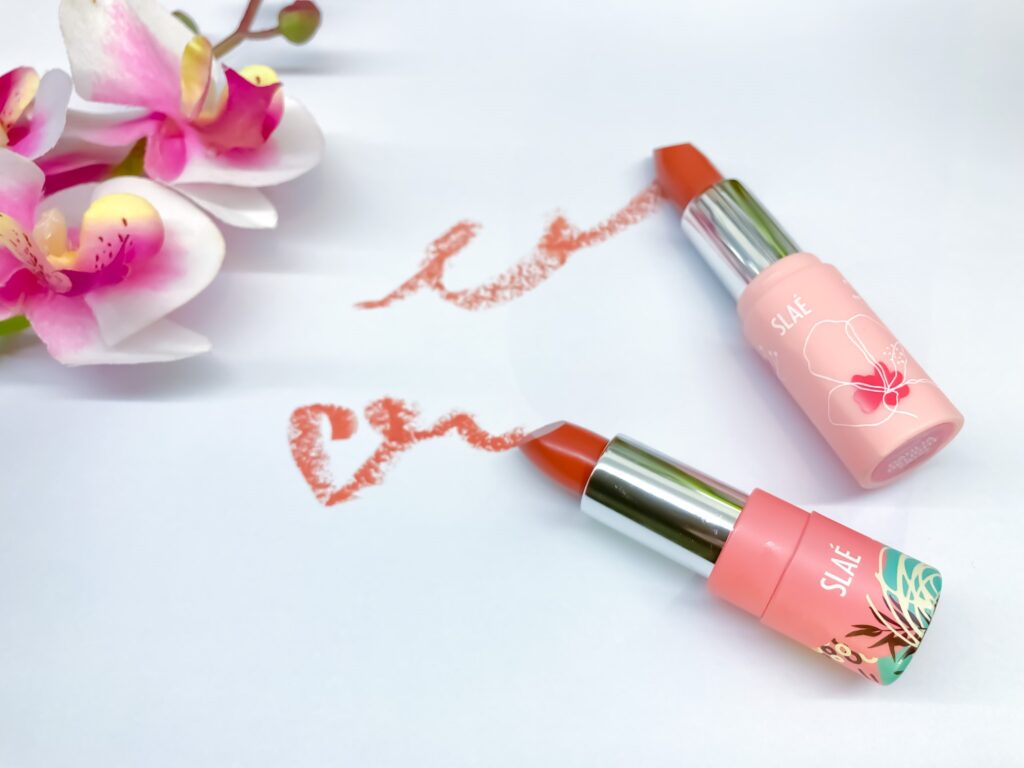 two matte lipsticks drawn on white paper