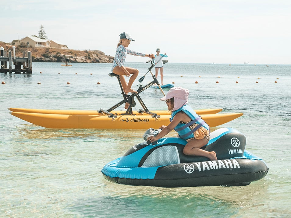 aquaplay rottnest kids playing on inflatable jetski, pedal boats and sup.
